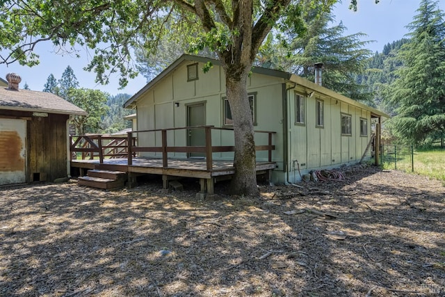 17651 Van Arsdale Rd, Potter Valley, CA 95469 - rear view of house with a wooden deck and board and batten siding