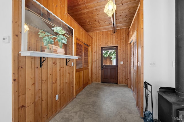 17651 Van Arsdale Rd, Potter Valley, CA 95469 - doorway to outside with wood walls, a wood stove, and wooden ceiling