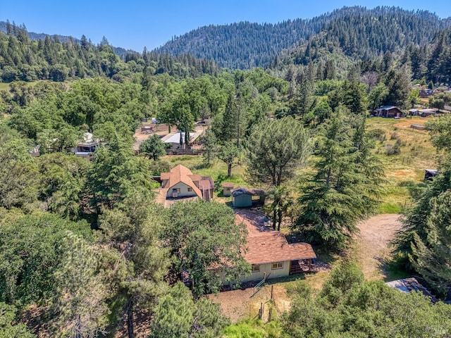 17651 Van Arsdale Rd, Potter Valley, CA 95469 - aerial view of property and surrounding area with a heavily wooded area and a mountain backdrop