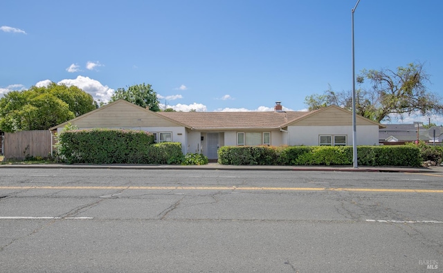 2409 Springs Rd, Vallejo, CA 94591 - ranch-style home featuring stucco siding and a chimney