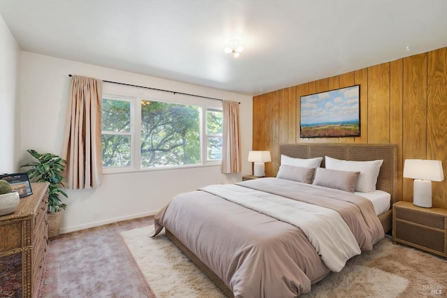 2409 Springs Rd, Vallejo, CA 94591 - bedroom featuring wooden walls, light carpet, and baseboards