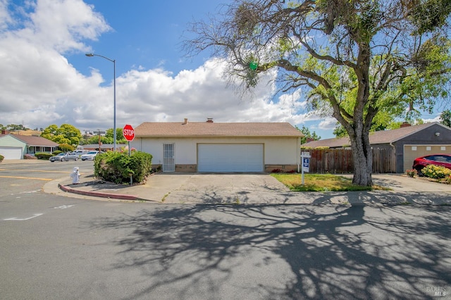 2409 Springs Rd, Vallejo, CA 94591 - single story home featuring fence, stucco siding, a garage, and driveway