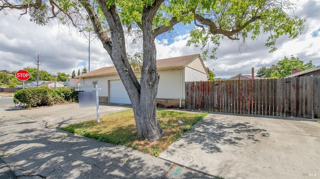 2409 Springs Rd, Vallejo, CA 94591 - view of home's exterior featuring driveway, fence, and stucco siding