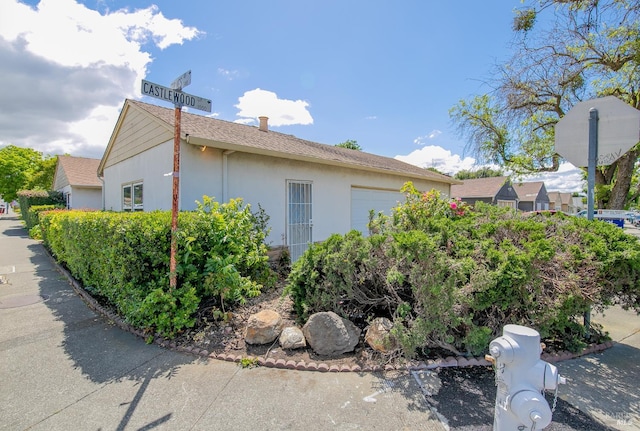 2409 Springs Rd, Vallejo, CA 94591 - view of home's exterior with stucco siding and a garage