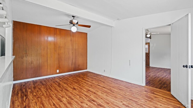 375 Las Colindas Rd, San Rafael, CA 94903 - unfurnished room with ceiling fan, wood finished floors, beamed ceiling, and wooden walls