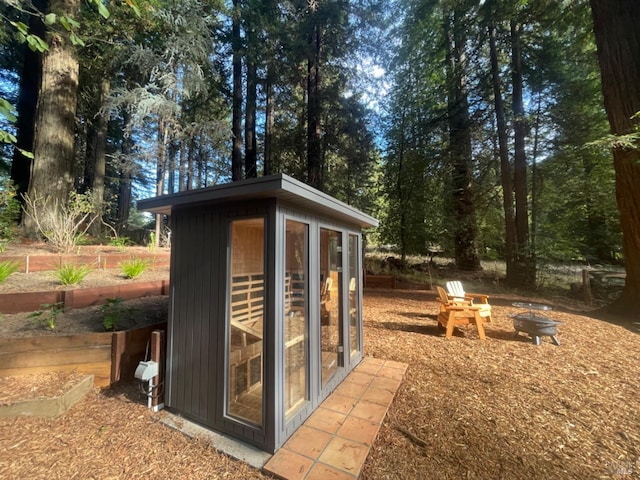 17075 Fitzpatrick Ln, Occidental, CA 95465 - view of outbuilding featuring a fire pit and an outdoor structure