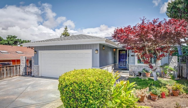 32 Romine Way, Vallejo, CA 94591 - view of front of house with stone siding, concrete driveway, a garage, and fence