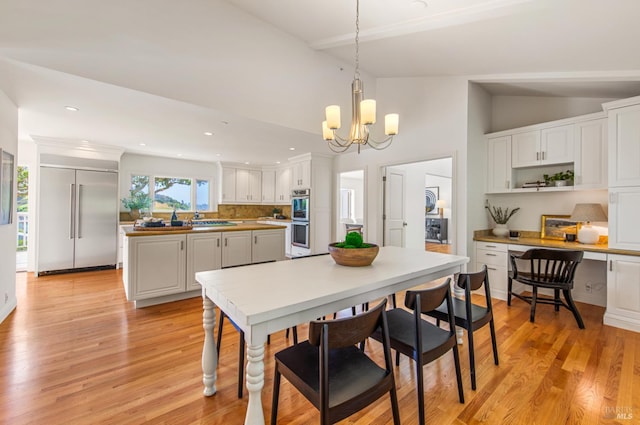 91 Round Hill Rd, Tiburon, CA 94920 - dining space featuring vaulted ceiling, a chandelier, light wood finished floors, and recessed lighting