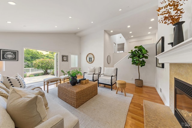 91 Round Hill Rd, Tiburon, CA 94920 - living room with light wood-style flooring, recessed lighting, lofted ceiling, a tiled fireplace, and baseboards
