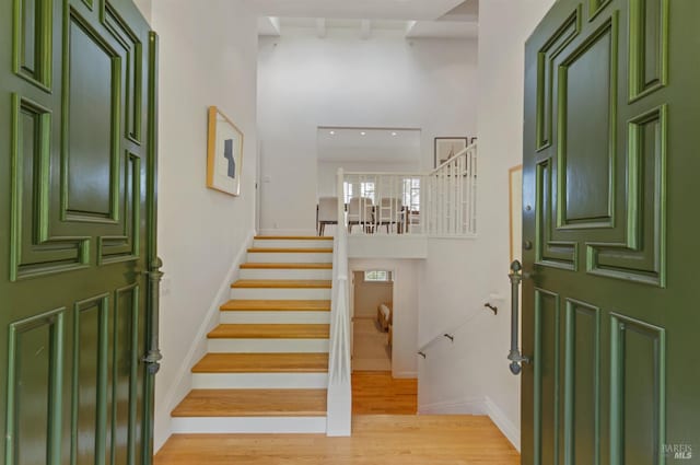 91 Round Hill Rd, Tiburon, CA 94920 - foyer entrance featuring a high ceiling, stairway, light wood-type flooring, and baseboards