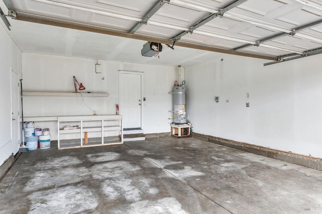 garage featuring water heater and a garage door opener