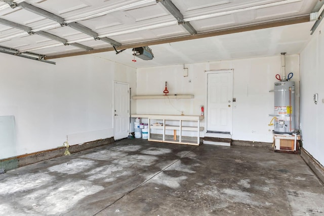 garage with water heater and a garage door opener