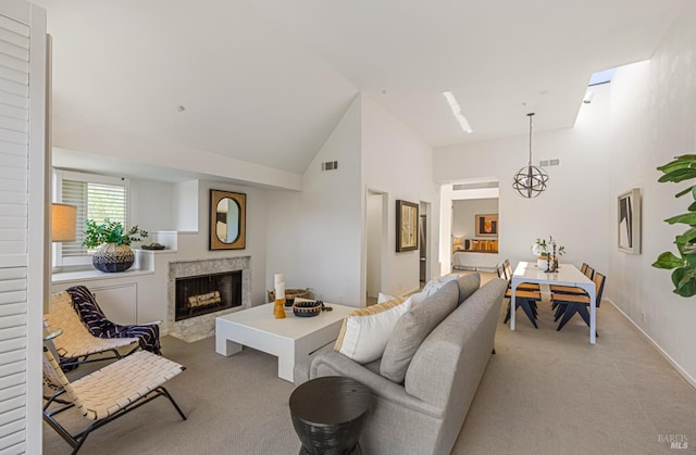 44 Lagoon Vis, Tiburon, CA 94920 - living room featuring light carpet, high vaulted ceiling, a premium fireplace, and baseboards