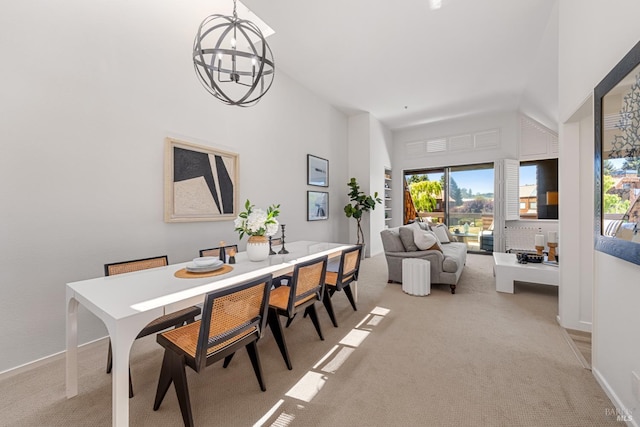 44 Lagoon Vis, Tiburon, CA 94920 - dining area featuring light colored carpet, a chandelier, vaulted ceiling, and baseboards