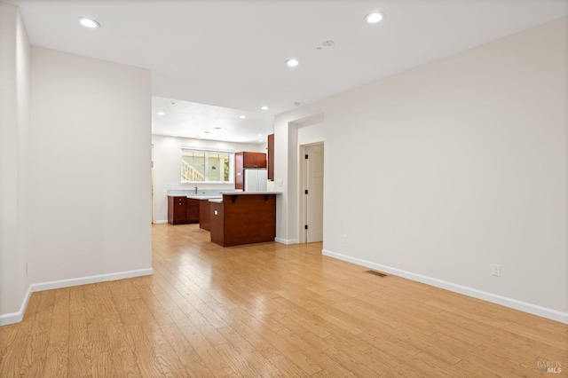 58 Randolph St, Napa, CA 94559 - unfurnished living room with light wood-type flooring, baseboards, and recessed lighting