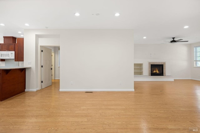 58 Randolph St, Napa, CA 94559 - unfurnished living room with a ceiling fan, light wood-style flooring, recessed lighting, baseboards, and a fireplace