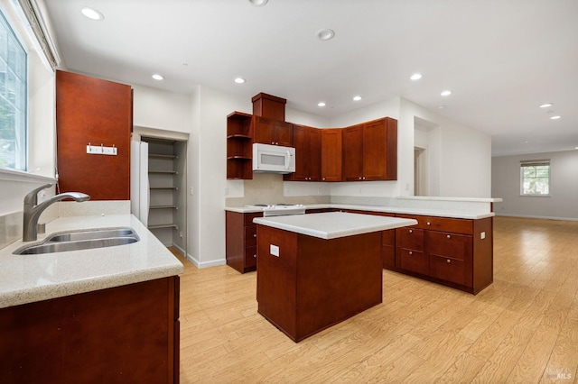 58 Randolph St, Napa, CA 94559 - kitchen with a sink, white microwave, a peninsula, light countertops, and open shelves