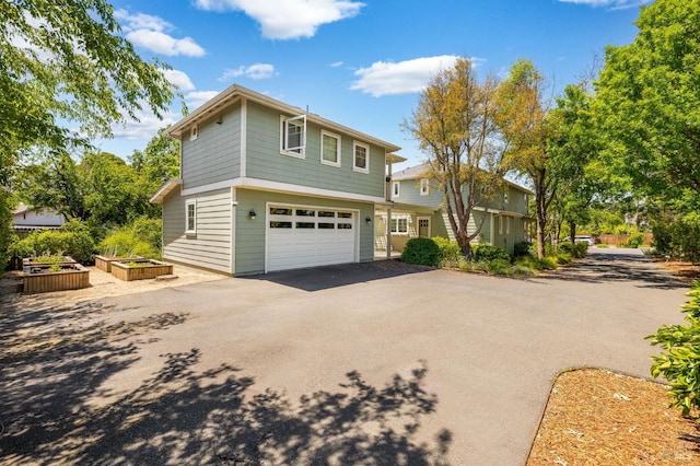 58 Randolph St, Napa, CA 94559 - view of front facade with driveway, an attached garage, and a garden