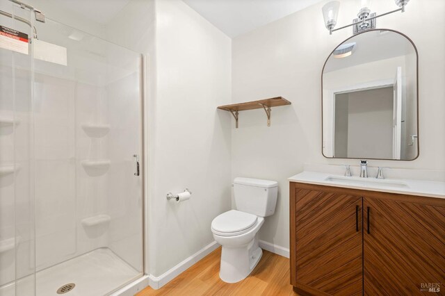 58 Randolph St, Napa, CA 94559 - full bathroom with wood finished floors, baseboards, a stall shower, toilet, and vanity