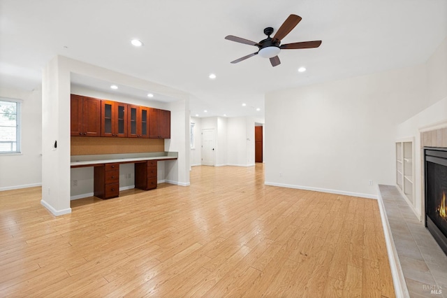 58 Randolph St, Napa, CA 94559 - unfurnished living room featuring a tile fireplace, recessed lighting, light wood-type flooring, a ceiling fan, and baseboards