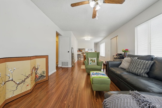 4214 Saturn Way, Union City, CA 94587 - living area with a textured ceiling, ceiling fan, wood finished floors, and baseboards