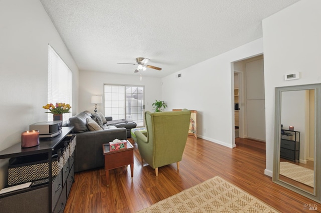 4214 Saturn Way, Union City, CA 94587 - living area featuring dark wood-type flooring, a ceiling fan, a textured ceiling, and baseboards