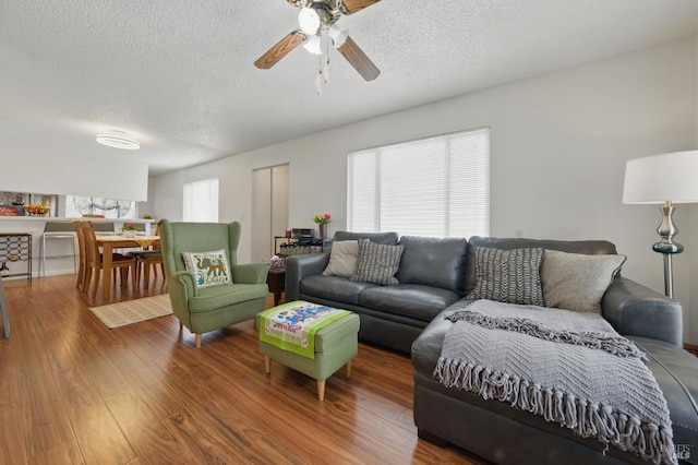 4214 Saturn Way, Union City, CA 94587 - living room featuring a textured ceiling, wood finished floors, and a ceiling fan