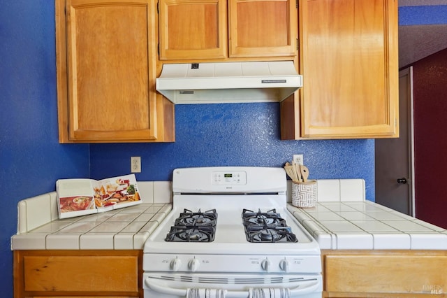 766 Morissette Way, Vacaville, CA 95687 - kitchen featuring gas range gas stove, under cabinet range hood, and tile counters