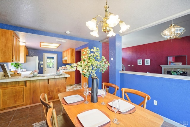 766 Morissette Way, Vacaville, CA 95687 - tiled dining area with a textured ceiling and a chandelier