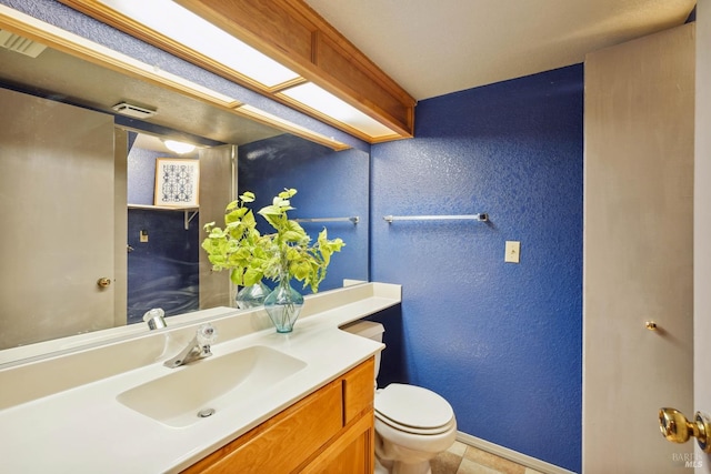 766 Morissette Way, Vacaville, CA 95687 - half bath with baseboards, toilet, a textured wall, vanity, and tile patterned flooring