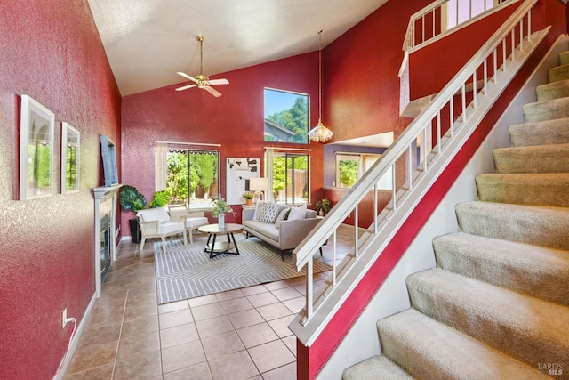766 Morissette Way, Vacaville, CA 95687 - tiled living area featuring stairs, a ceiling fan, and high vaulted ceiling