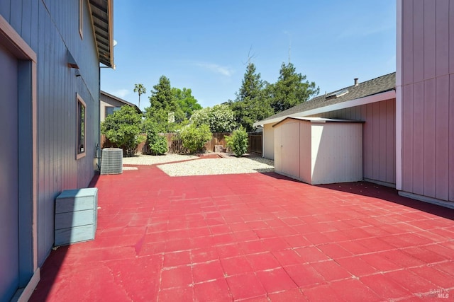 766 Morissette Way, Vacaville, CA 95687 - view of patio featuring a shed, central AC unit, an outbuilding, and a fenced backyard