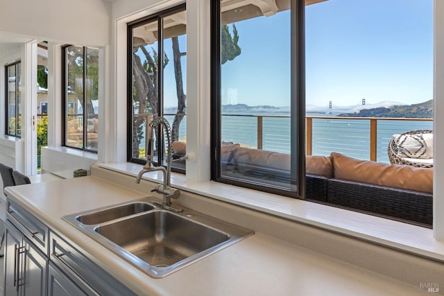419 Golden Gate Ave, Belvedere, CA 94920 - kitchen with a sink, a water view, light countertops, and open floor plan