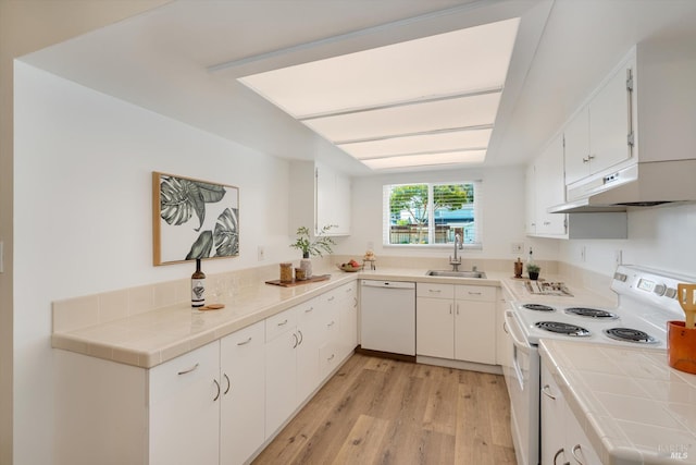 1828 Trower Ave, Napa, CA 94558 - kitchen with white appliances, a sink, under cabinet range hood, light wood-type flooring, and tile countertops