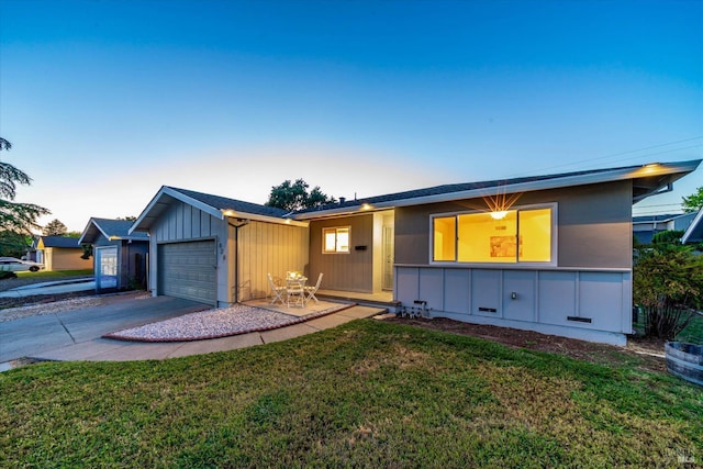 1828 Trower Ave, Napa, CA 94558 - single story home with a garage, board and batten siding, driveway, and a front yard
