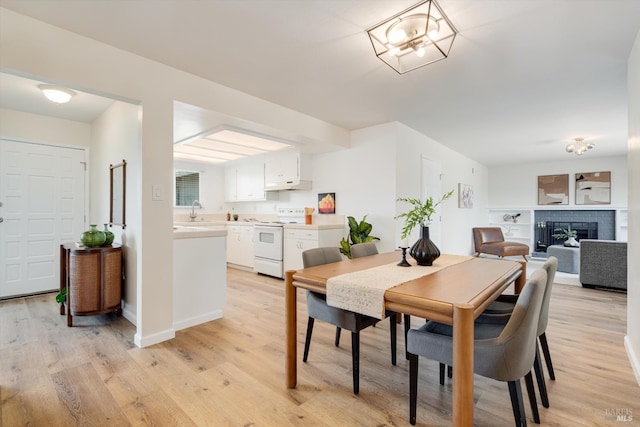 1828 Trower Ave, Napa, CA 94558 - dining room with light wood-type flooring and a fireplace