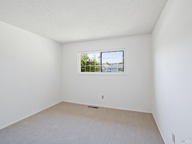 175 Temelec Cir, Sonoma, CA 95476 - unfurnished room with carpet, a textured ceiling, and baseboards