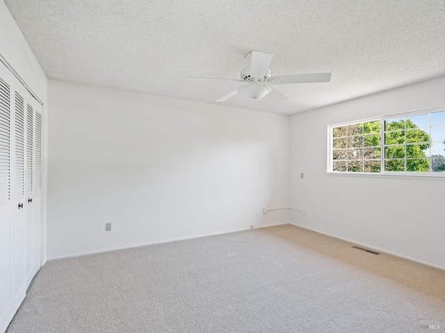 175 Temelec Cir, Sonoma, CA 95476 - unfurnished bedroom featuring a closet, light carpet, a textured ceiling, ceiling fan, and baseboards