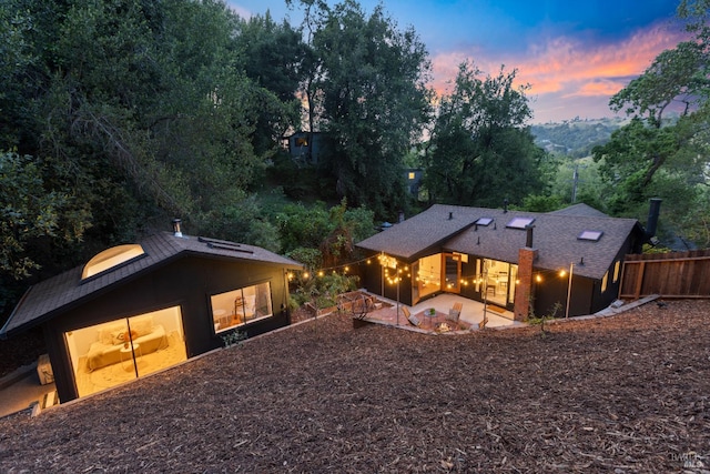 back of house featuring fence and a patio area