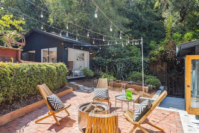 view of patio featuring a fire pit and an outdoor structure