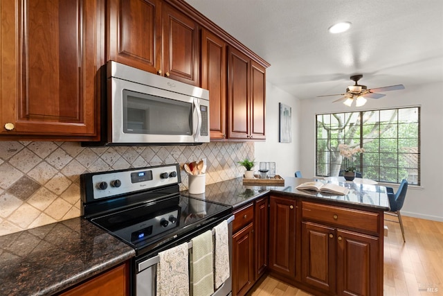 20912 Via Colombard, Sonoma, CA 95476 - kitchen featuring stainless steel appliances, light wood-style flooring, a peninsula, decorative backsplash, and recessed lighting