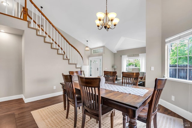 2812 Silver Fox Cir, Fairfield, CA 94534 - dining room featuring a chandelier, wood finished floors, baseboards, stairway, and high vaulted ceiling