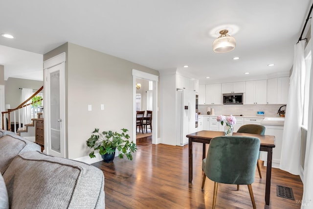 2812 Silver Fox Cir, Fairfield, CA 94534 - living area with dark wood-type flooring, stairs, and recessed lighting