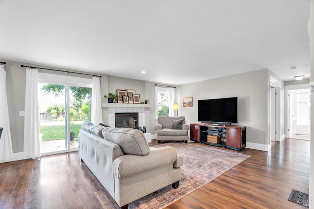 2812 Silver Fox Cir, Fairfield, CA 94534 - living room with dark wood-type flooring, plenty of natural light, a tile fireplace, baseboards, and recessed lighting
