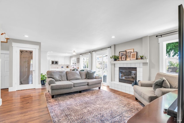 2812 Silver Fox Cir, Fairfield, CA 94534 - living area with recessed lighting, wood finished floors, a tile fireplace, and healthy amount of natural light