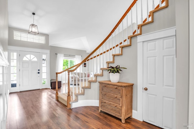2812 Silver Fox Cir, Fairfield, CA 94534 - foyer with dark wood-type flooring, stairway, baseboards, and vaulted ceiling