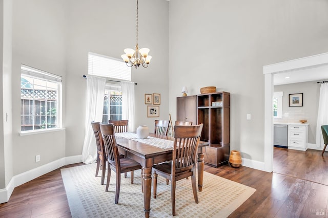 2812 Silver Fox Cir, Fairfield, CA 94534 - dining space with a high ceiling, baseboards, a chandelier, and dark wood-style floors