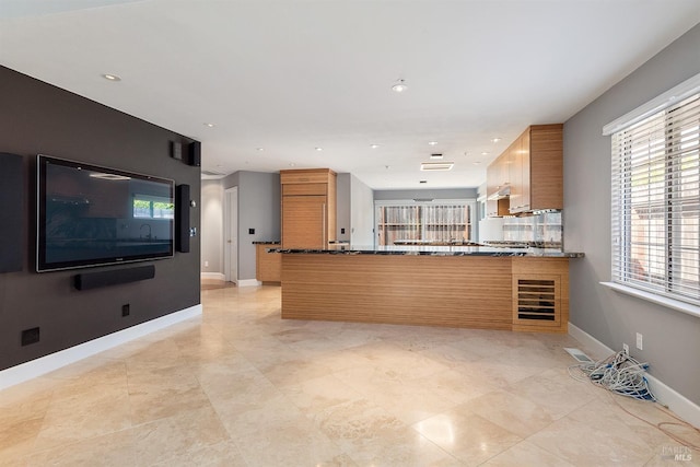 431 University St, Healdsburg, CA 95448 - kitchen with brown cabinetry, a peninsula, baseboards, and recessed lighting
