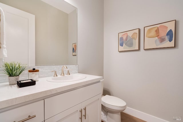 223 Pheasant Ct, Napa, CA 94558 - half bathroom featuring tasteful backsplash, vanity, baseboards, toilet, and wood finished floors