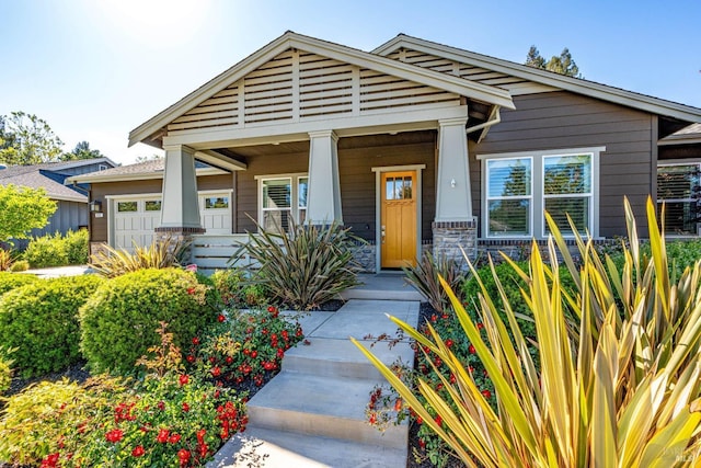 223 Pheasant Ct, Napa, CA 94558 - craftsman-style house with covered porch, stone siding, and an attached garage